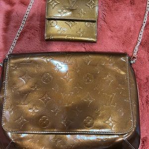 Authentic L.V bronze shiny bag and matching wallet.